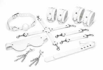 Набір Feral Feelings BDSM Kit 7 White, наручники, поножі, конектор, маска, падл, кляп, затискачі SX3982 фото - купити в секс-шопі Чорний Кролик